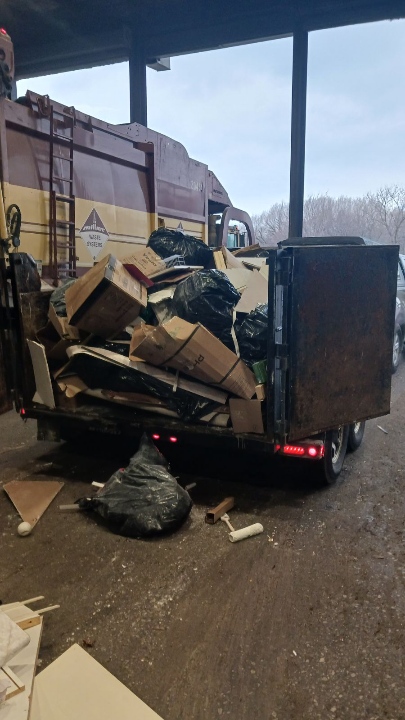 Dump trailer loaded with renovation debris