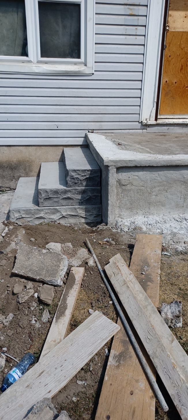 Precast concrete steps installed at a home entrance
