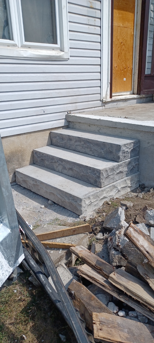 Finished precast concrete steps at a side entrance