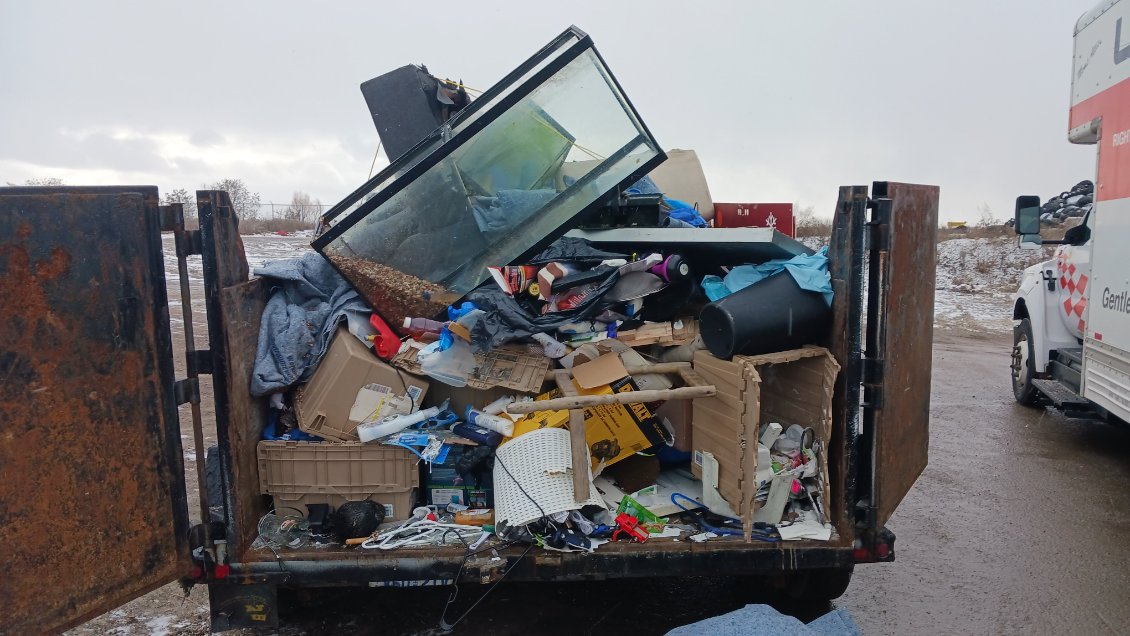 Dump trailer loaded with mixed household garbage
