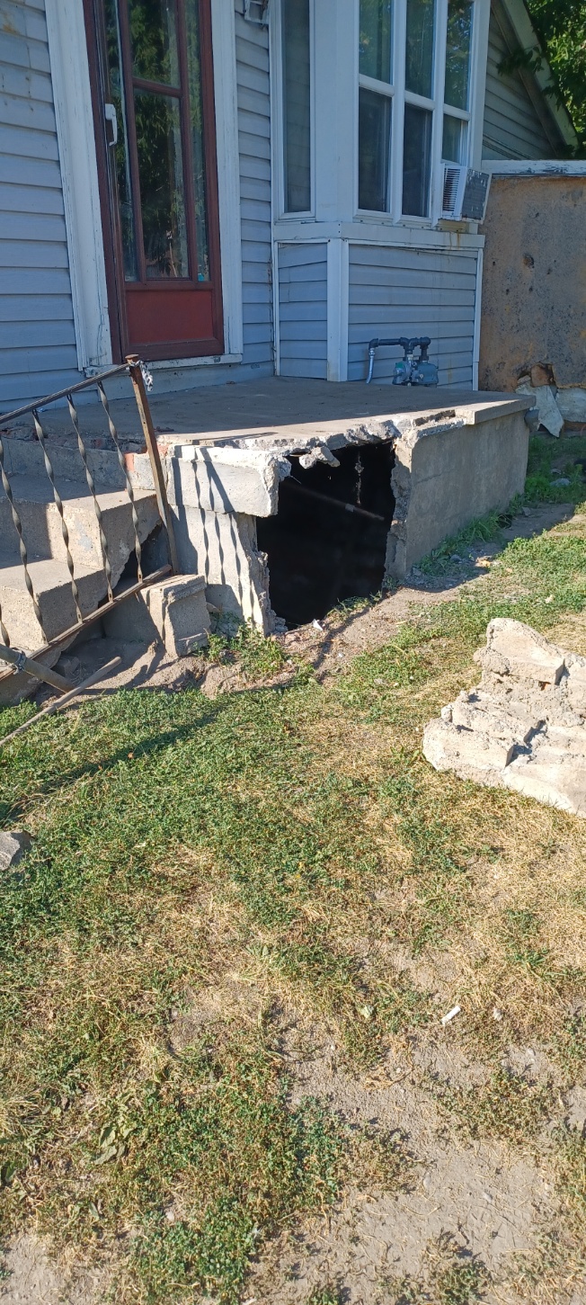 Old concrete porch step removed for replacement