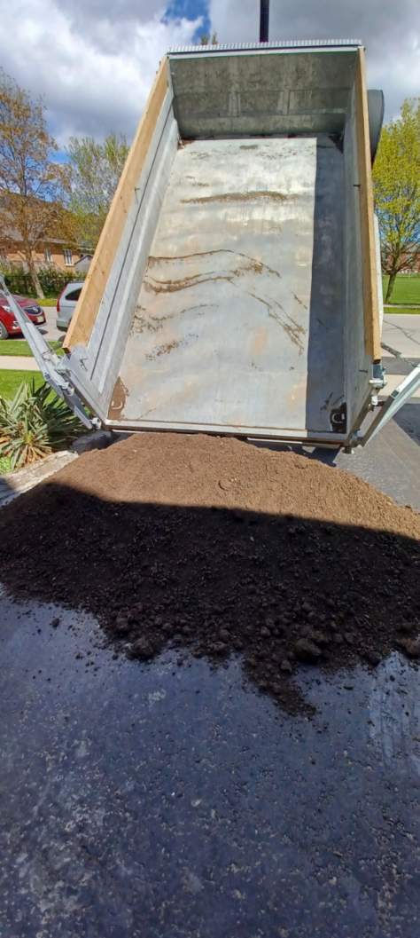Topsoil being delivered from Patrick's dump trailer